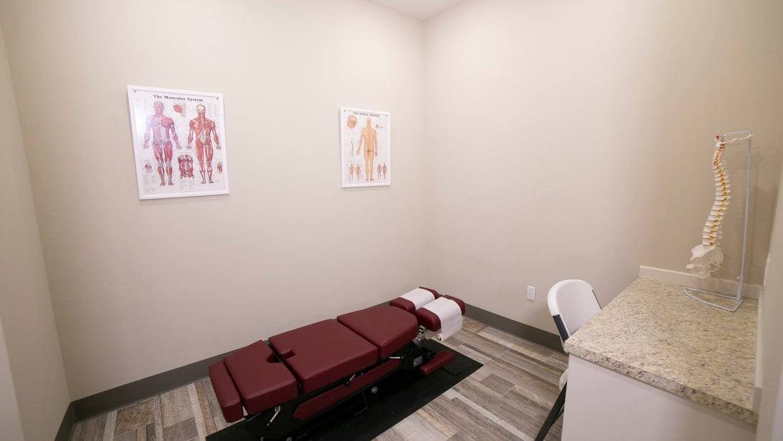 Chiropractic treatment table with headrest inside a clinic