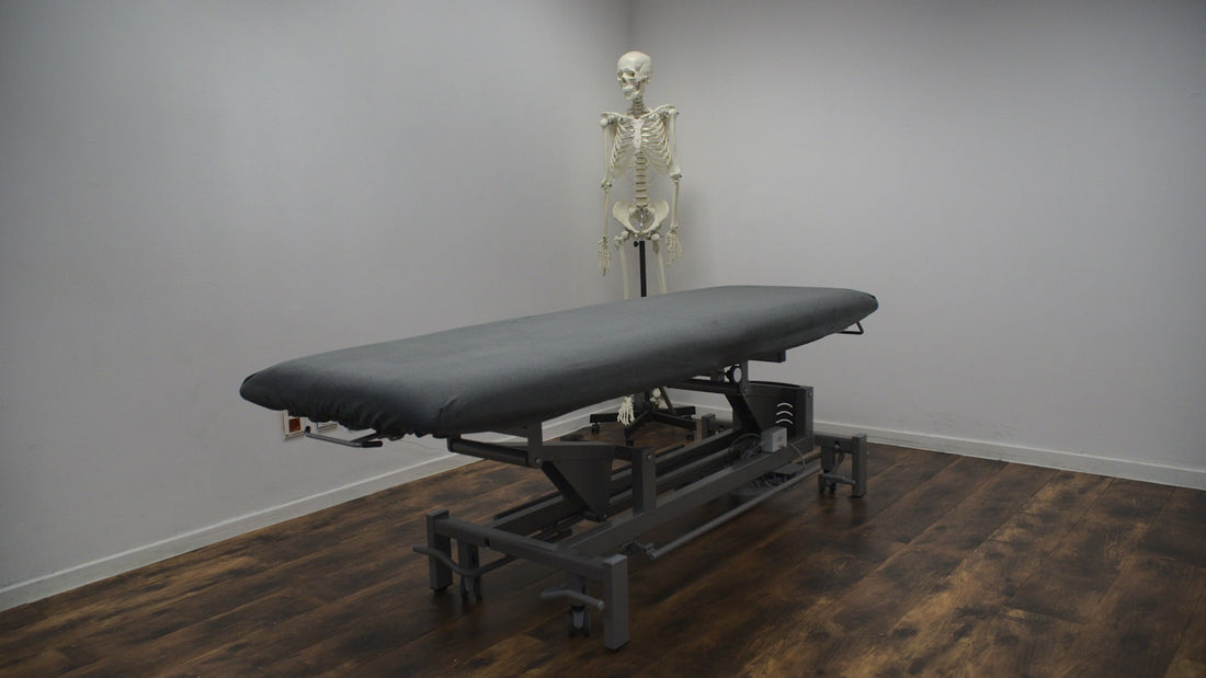 Chiropractic treatment table frame in a clinic treatment room